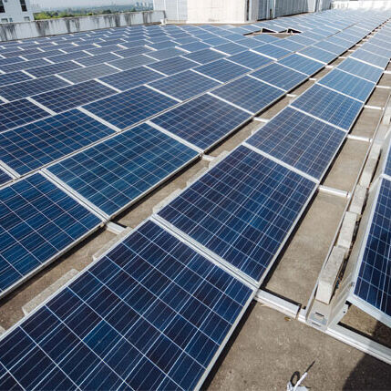 Commercial solar panels installed on a business rooftop by Sharp EIT