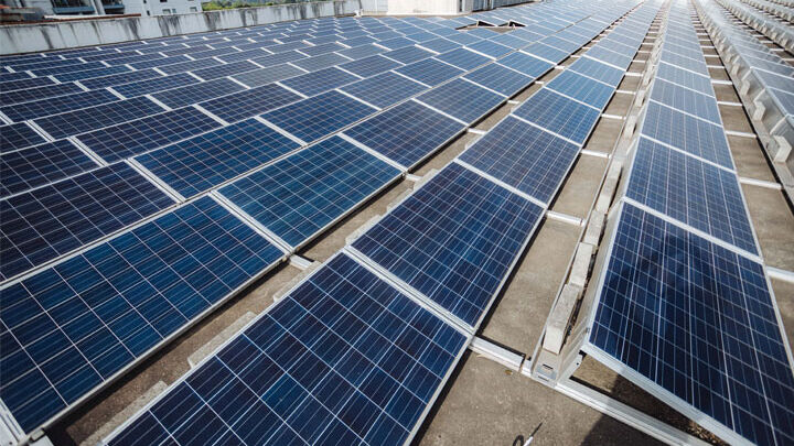 Commercial solar panels installed on a business rooftop by Sharp EIT