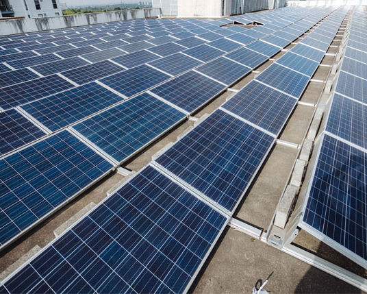 Commercial solar panels installed on a business rooftop by Sharp EIT